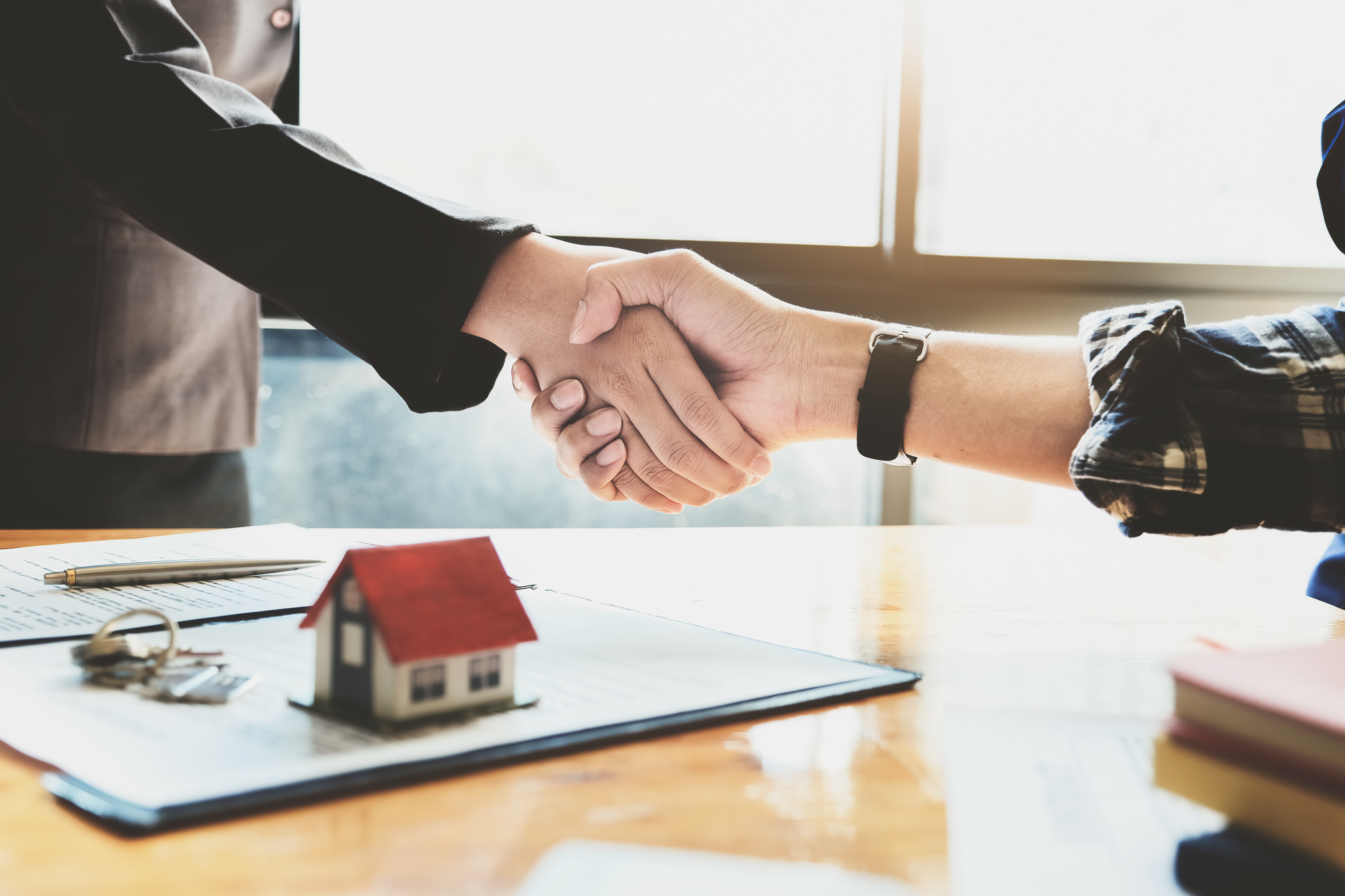 Real Estate Agent Handshake With Customer